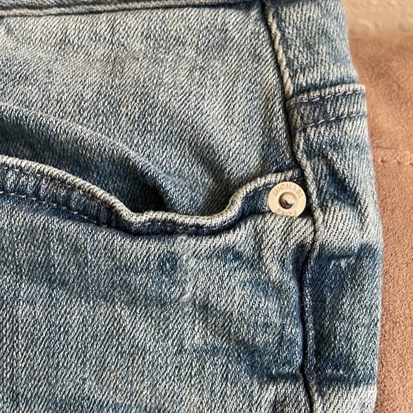 Light wash, distressed, stretchy jeans. - Picture 2 of 4